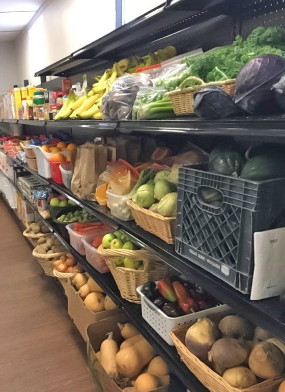 Fresh produce on shelves for food pantry guests